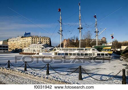 Stock Image - Russia, St Petersburg, boats on ice.. Fotosearch