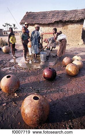 Ivory Coast, women and children in front of a well. View Large Photo Image Stock Photo - Ivory Coast, women and children in front of a well.. Fotosearch