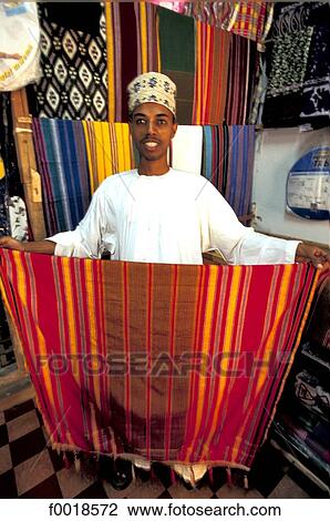 Stock Image - Kenya, Lamu, seller of tissue.. Fotosearch