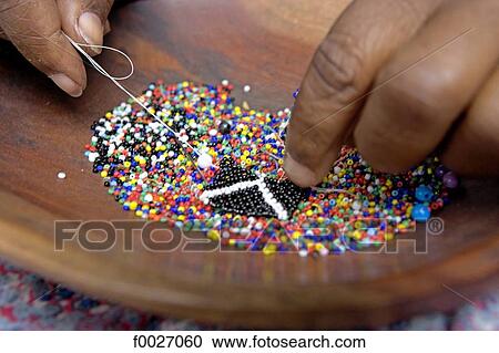 South Africa, Zululand, near Santa Lucia Park, Zulu craft center, making of beads jewels View Large Photo Image Stock Image - South Africa, Zululand, near Santa Lucia Park, Zulu craft center, making of beads jewels. Fotosearch