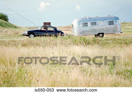 Stock Image - A car pulling a caravan. Fotosearch