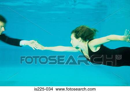 A couple dancing in a swimming pool View Large Photo Image Picture - A couple dancing in a swimming pool. Fotosearch