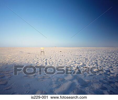 A lonely chair on golden sand View Large Photo Image Stock Image - A lonely chair on golden sand . Fotosearch