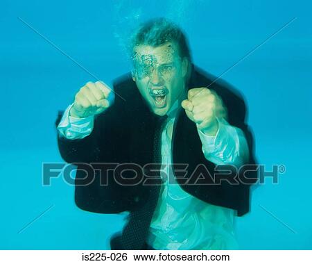 A man fighting under the water View Large Photo Image Stock Photograph - A man fighting under the water. Fotosearch