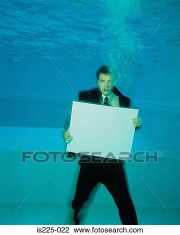 A man in a suit under the water View Large Photo Image Stock Image - A man in a suit under the water. Fotosearch