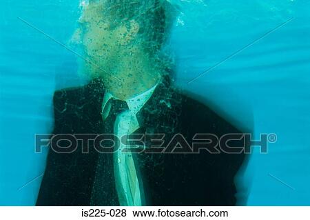 A man in a suit under the water View Large Photo Image Stock Photo - A man in a suit under the water. Fotosearch