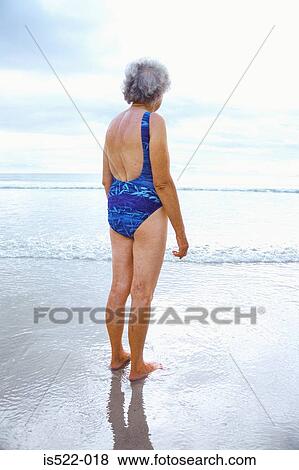 A mature woman looking at the sea View Large Photo Image Stock Photo - A mature woman looking at the sea. Fotosearch