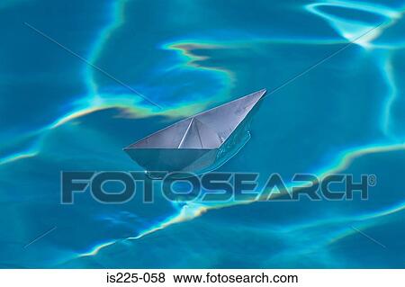 A paper boat on a swimming pool View Large Photo Image Stock Photo - A paper boat on a swimming pool. Fotosearch
