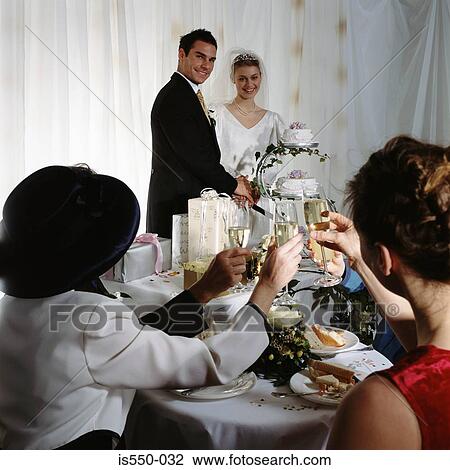 Stock Image - A toast to the newly-weds . Fotosearch