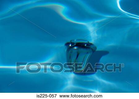An alarm clock on the bottom of a swimming pool View Large Photo Image Stock Photo - An alarm clock on the bottom of a swimming pool. Fotosearch