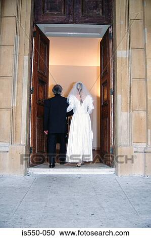 Bride goes into church with her father View Large Photo Image Stock Image - Bride goes into church with her father. Fotosearch