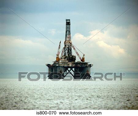 Stock Image - clouds, horizon, oil rig, sea, sky. Fotosearch