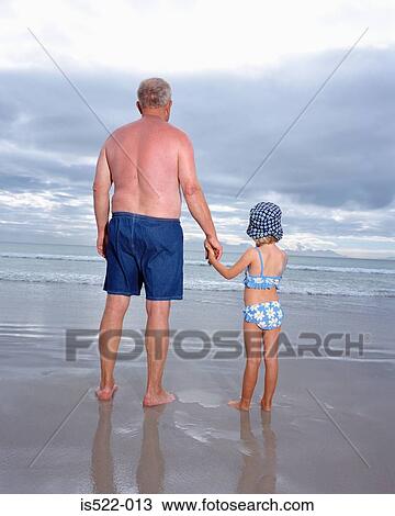 Grandad holding granddaughter`s hand View Large Photo Image Stock Image - Grandad holding granddaughter`s hand . Fotosearch
