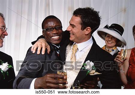 Groom hugs best man View Large Photo Image Stock Image - Groom hugs best man. Fotosearch