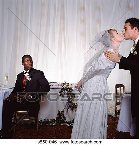 Groom kisses bride View Large Photo Image Stock Photograph - Groom kisses bride. Fotosearch