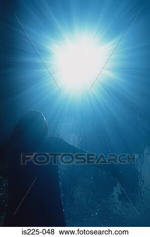 Stock Photo - Swimming towards the light. Fotosearch