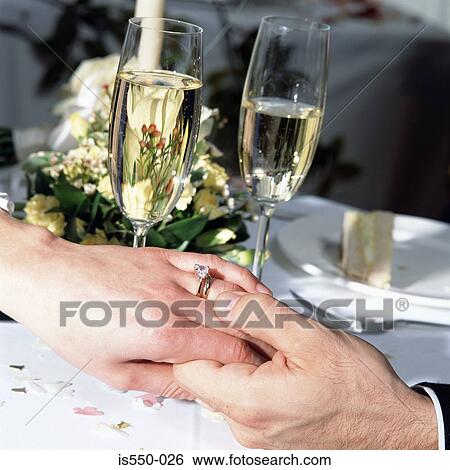 The newly-weds holding hands View Large Photo Image Stock Photograph - The newly-weds holding hands. Fotosearch