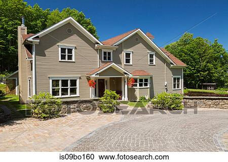 1990s Contemporary Victorian style country home facade with hanging baskets and driveway View Large Photo Image Stock Image - 1990s Contemporary Victorian style country home facade with hanging baskets and driveway. Fotosearch