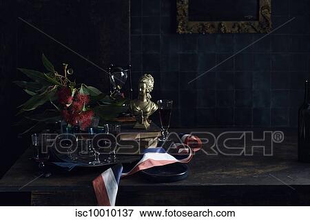 A Bastille Day celebration, tray of glasses with red wine, traditional old master painting and a red white and blue ribbon, colours of the French flag.. View Large Photo Image Stock Photo - A Bastille Day celebration, tray of glasses with red wine, traditional old master painting and a red white and blue ribbon, colours of the French flag... Fotosearch