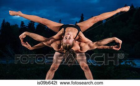 Stock Photograph - Acrobats performing on outdoor stage, Bainbridge, Washington, USA. Fotosearch