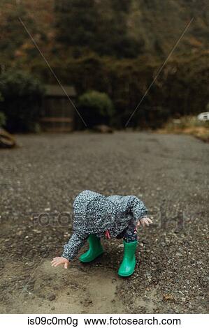 Stock Image - Baby exploring nature, Queenstown, Canterbury, New Zealand. Fotosearch