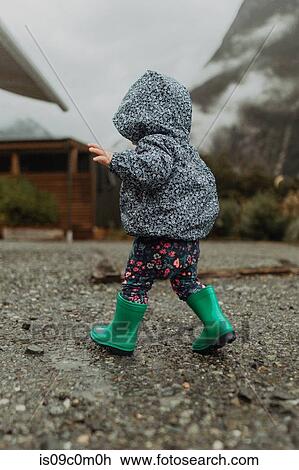 Stock Image - Baby exploring nature, Queenstown, Canterbury, New Zealand. Fotosearch