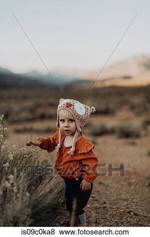 Baby girl walking by herself, Kennedy Meadows, California, US View Large Photo Image Stock Photo - Baby girl walking by herself, Kennedy Meadows, California, US. Fotosearch