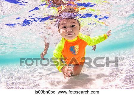 Baby swimming in ocean View Large Photo Image Stock Image - Baby swimming in ocean. Fotosearch