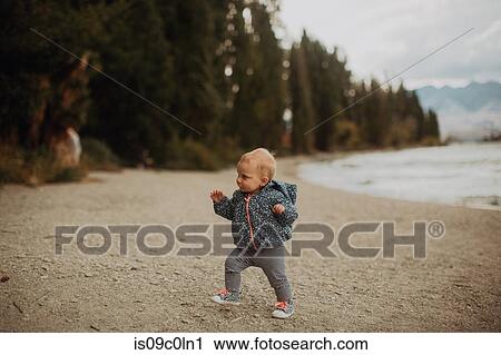 Baby walking on beach, Wanaka, Taranaki, New Zealand View Large Photo Image Stock Image - Baby walking on beach, Wanaka, Taranaki, New Zealand. Fotosearch