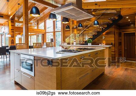 Bamboo wood kitchen island with white quartz countertops, luxurious cedar wood home View Large Photo Image Stock Photograph - Bamboo wood kitchen island with white quartz countertops, luxurious cedar wood home. Fotosearch