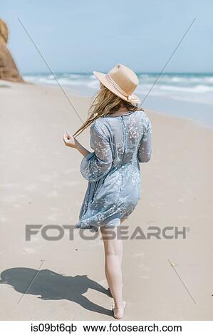 Barefoot young woman strolling on beach, Menemsha, Martha's Vineyard, Massachusetts, USA View Large Photo Image Stock Image - Barefoot young woman strolling on beach, Menemsha, Martha's Vineyard, Massachusetts, USA. Fotosearch