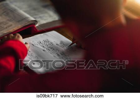 Boy doing homework View Large Photo Image Stock Photo - Boy doing homework. Fotosearch