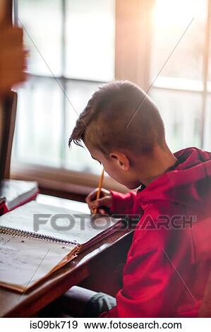 Boy doing homework View Large Photo Image Stock Photo - Boy doing homework. Fotosearch