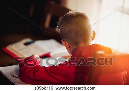 Boy doing homework View Large Photo Image Stock Photograph - Boy doing homework. Fotosearch