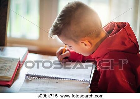 Boy doing homework View Large Photo Image Stock Photography - Boy doing homework. Fotosearch