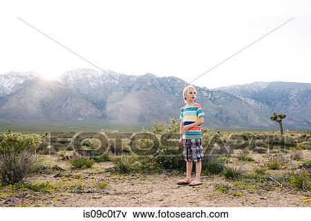 Boy exploring rural landscape, Olancha, California, US View Large Photo Image Stock Photo - Boy exploring rural landscape, Olancha, California, US. Fotosearch