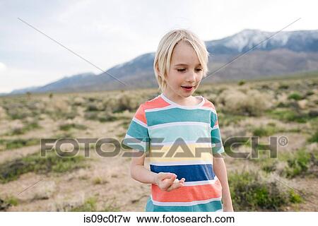 Boy exploring rural landscape, Olancha, California, US View Large Photo Image Stock Photo - Boy exploring rural landscape, Olancha, California, US. Fotosearch