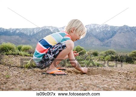 Boy exploring rural landscape, Olancha, California, US View Large Photo Image Stock Photo - Boy exploring rural landscape, Olancha, California, US. Fotosearch