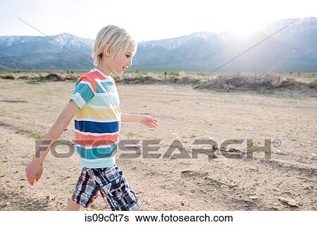 Boy exploring rural landscape, Olancha, California, US View Large Photo Image Stock Photograph - Boy exploring rural landscape, Olancha, California, US. Fotosearch