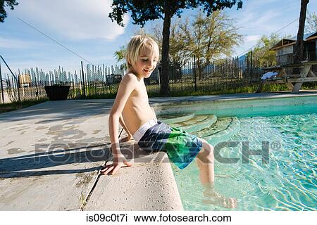 Boy sitting by swimming pool, Olancha, California, US View Large Photo Image Stock Image - Boy sitting by swimming pool, Olancha, California, US. Fotosearch