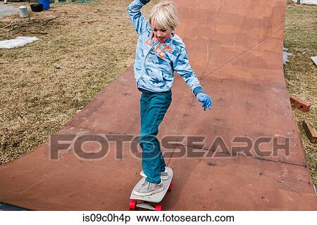 Boy skateboarding on wooden skateboard ramp View Large Photo Image Stock Photography - Boy skateboarding on wooden skateboard ramp. Fotosearch