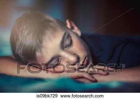 Boy sleeping on front View Large Photo Image Stock Photo - Boy sleeping on front. Fotosearch