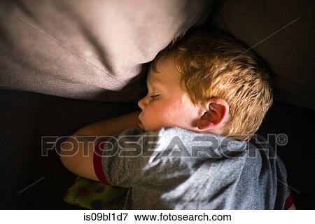 Boy sleeping on sofa View Large Photo Image Stock Photo - Boy sleeping on sofa. Fotosearch