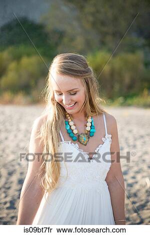 Bride in wedding dress on beach at sunset View Large Photo Image Stock Photography - Bride in wedding dress on beach at sunset. Fotosearch