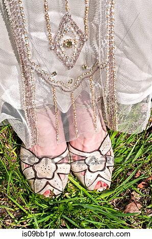 Bride wearing vintage wedding dress and shoes, close-up, low section View Large Photo Image Stock Image - Bride wearing vintage wedding dress and shoes, close-up, low section. Fotosearch
