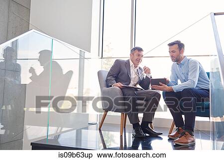 Business men with digital tablet in meeting View Large Photo Image Stock Photography - Business men with digital tablet in meeting. Fotosearch