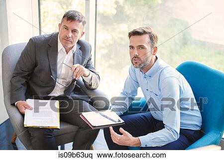 Business men with digital tablet in meeting View Large Photo Image Stock Photography - Business men with digital tablet in meeting. Fotosearch