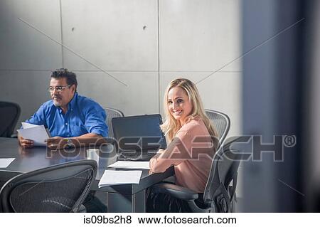 Businessman and businesswoman at meeting in office View Large Photo Image Stock Photo - Businessman and businesswoman at meeting in office. Fotosearch