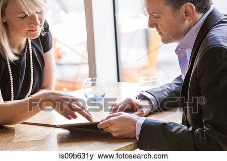 Businessman and businesswoman working View Large Photo Image Stock Photo - Businessman and businesswoman working. Fotosearch