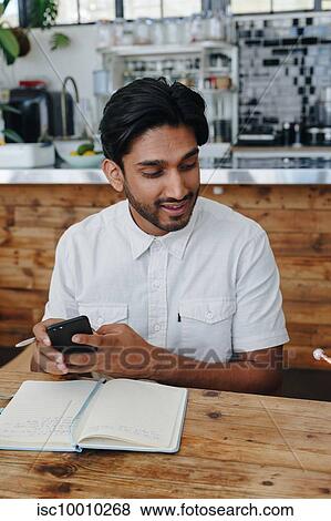 Businessman at office meeting View Large Photo Image Stock Photo - Businessman at office meeting. Fotosearch